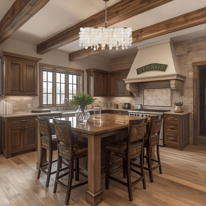 Elsa 5-light linear chandelier with capiz shell design hanging above a rustic wooden kitchen island in a warm traditional kitchen.