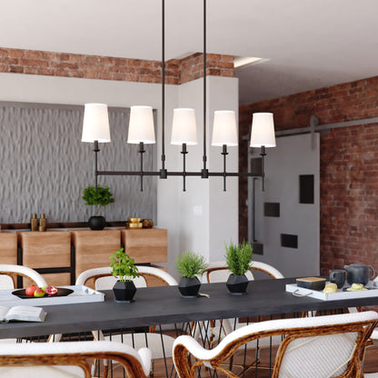 Camden 45.5-inch 5 Light Linear Chandelier in matte black displayed in a modern dining room with brick walls, wood textures, and contemporary decor elements
