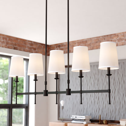 Close-up view of the Camden 45.5-inch 5 Light Linear Chandelier showing its white linen fabric shades and matte black linear frame in a bright modern room