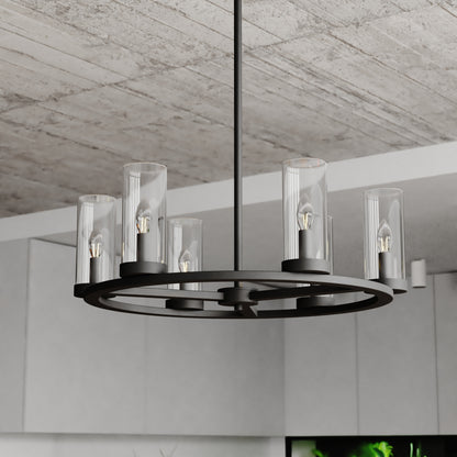 Close-up view of the Grantley 26-inch 6 Light Indoor-Outdoor Chandelier showing matte black ring frame and six clear glass cylinder shades in a modern setting
