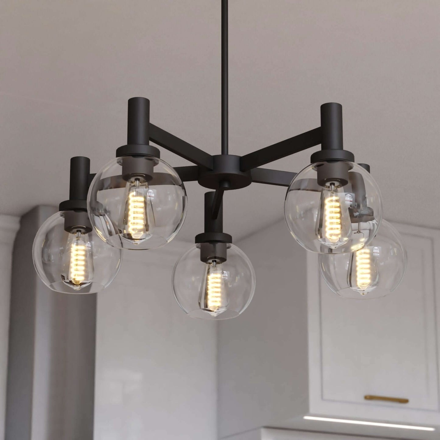 Close-up view of the Marshall 27-inch 5 Light chandelier featuring matte black arms with clear round glass globes and Edison-style LED bulbs.