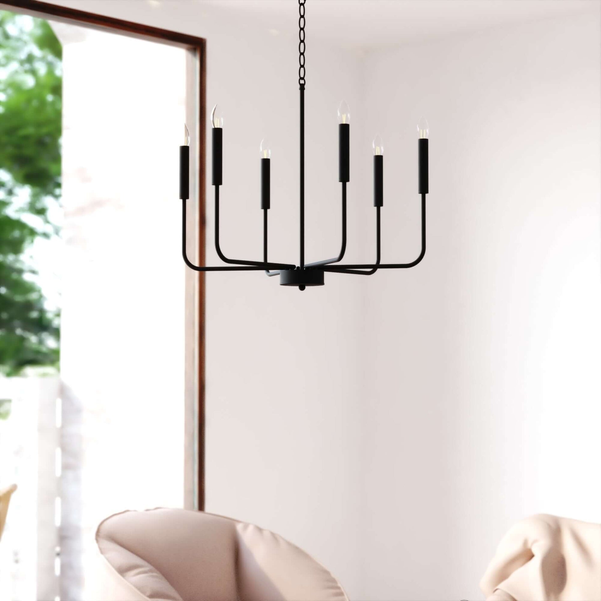 Belden 26-inch 6 Light chandelier displayed in a modern room setting, featuring sleek upward black arms with minimalist candle-style bulbs.