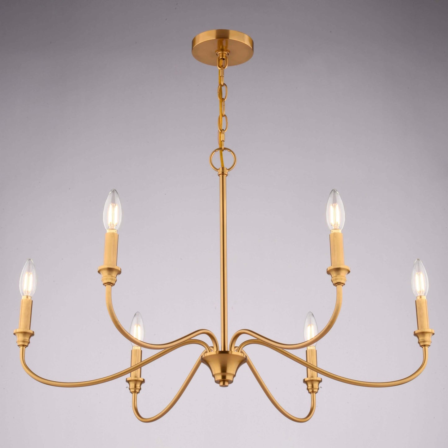 Low-angle front view of Annabelle 30-inch wide 6-light chandelier in satin brass, shown installed against a neutral background